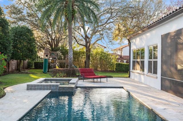 view of swimming pool featuring a patio area, an in ground hot tub, a playground, and a fenced in pool