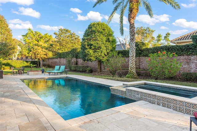 view of swimming pool with a fenced in pool, a fenced backyard, a patio, and an in ground hot tub