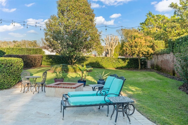 view of patio featuring a fire pit and a fenced backyard