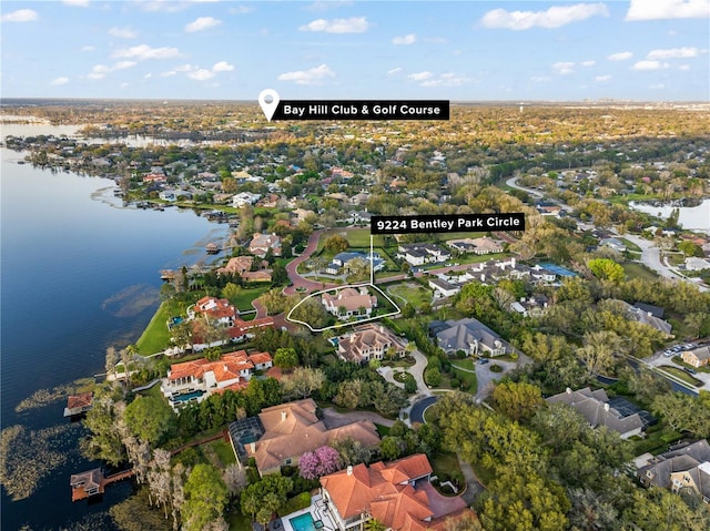 birds eye view of property with a residential view and a water view