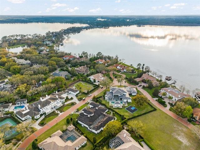 birds eye view of property with a water view and a residential view