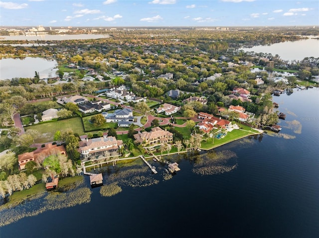 drone / aerial view featuring a water view and a residential view