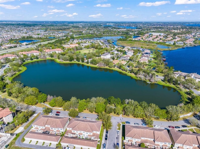 drone / aerial view featuring a water view and a residential view