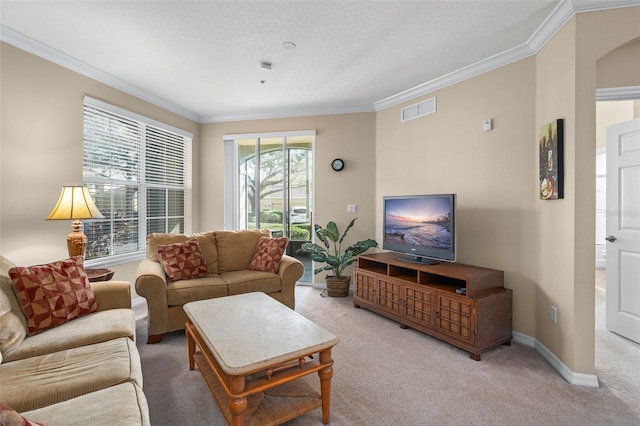 living room featuring ornamental molding, carpet, visible vents, and baseboards