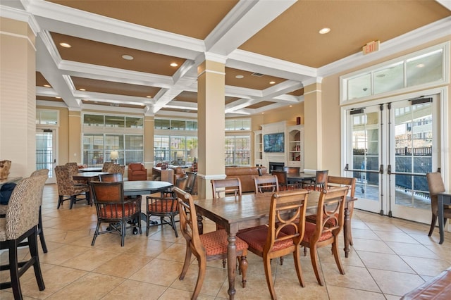 dining area with beam ceiling, coffered ceiling, crown molding, and french doors