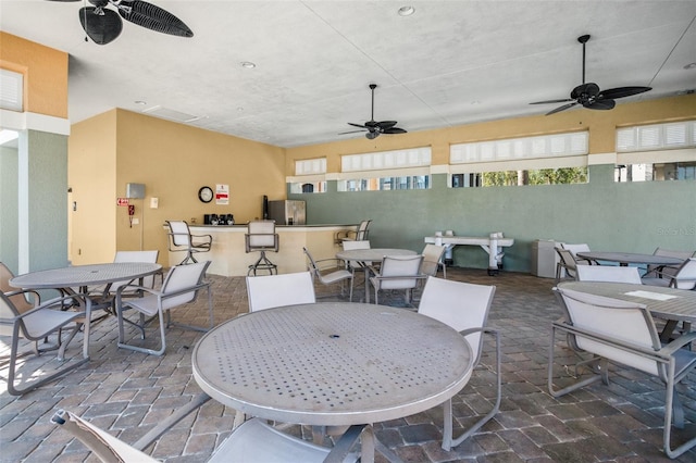 view of patio featuring ceiling fan and outdoor dining space