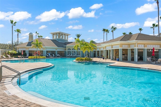 community pool with a patio area