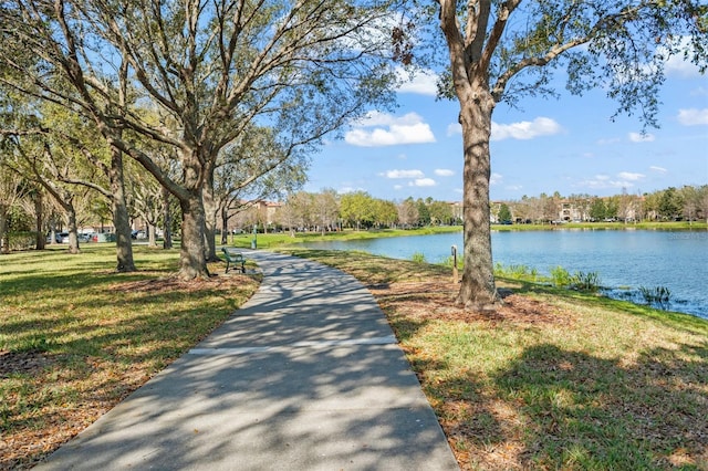 exterior space with a lawn and a water view