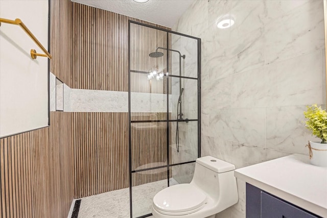 full bathroom featuring a textured ceiling, toilet, a wainscoted wall, tile walls, and walk in shower