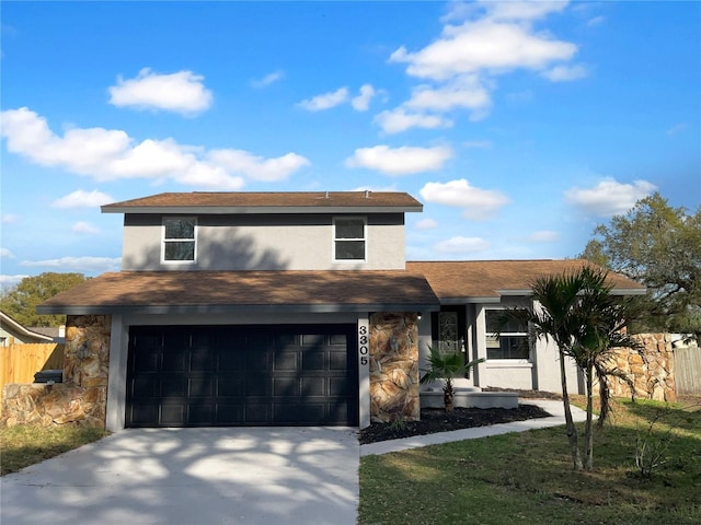 view of front of property featuring a garage, fence, concrete driveway, and stucco siding