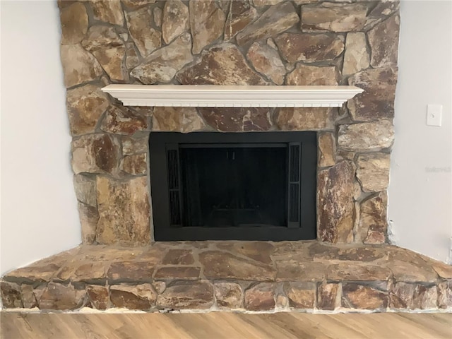 interior details with a fireplace with raised hearth