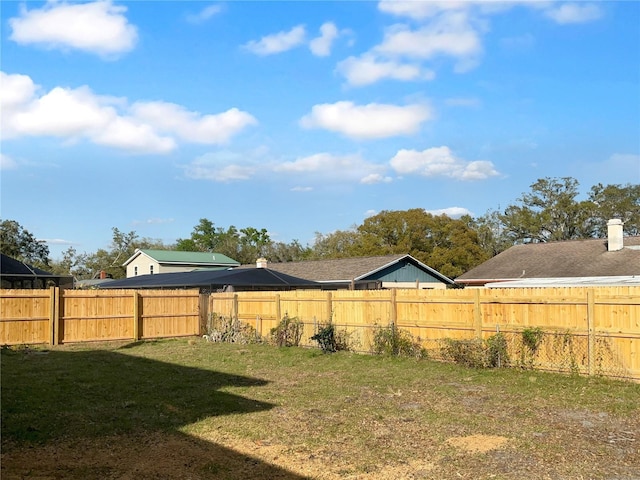 view of yard featuring a fenced backyard