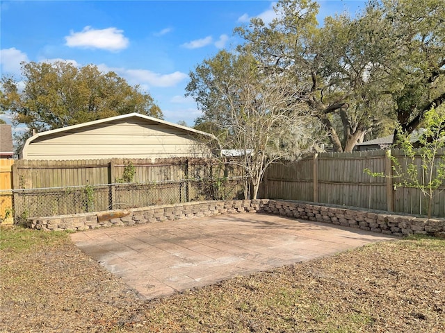 view of yard with a patio area and a fenced backyard