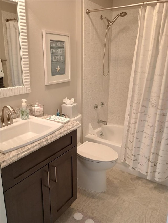 bathroom featuring vanity, toilet, and shower / bath combo with shower curtain