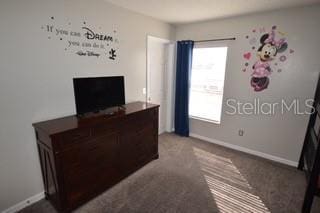 954 Lockbreeze Dr, Davenport, FL 33897 - unfurnished office featuring healthy amount of natural light and carpet