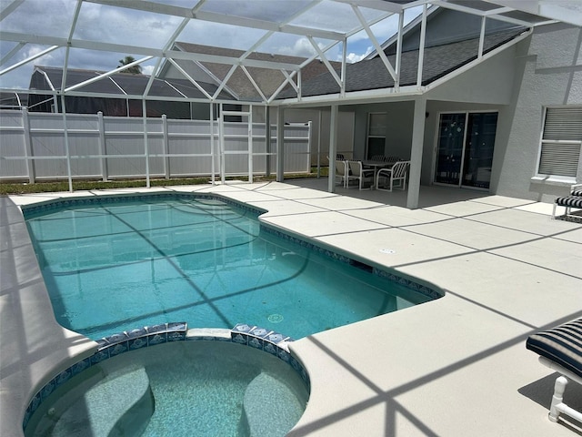 954 Lockbreeze Dr, Davenport, FL 33897 - view of pool featuring a pool with connected hot tub, a patio, glass enclosure, and outdoor dining area