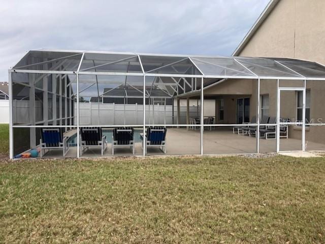 954 Lockbreeze Dr, Davenport, FL 33897 - back of property with a patio area, a lanai, and a lawn