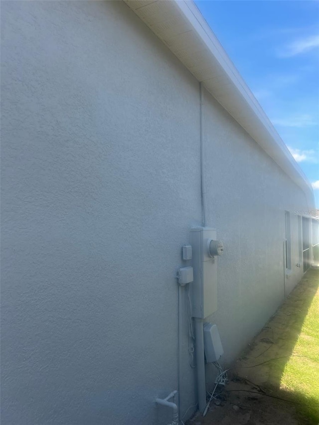 954 Lockbreeze Dr, Davenport, FL 33897 - view of side of home featuring stucco siding