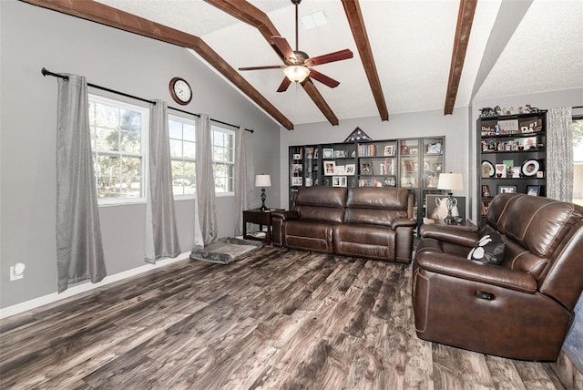 living area with lofted ceiling with beams, wood finished floors, a ceiling fan, and baseboards