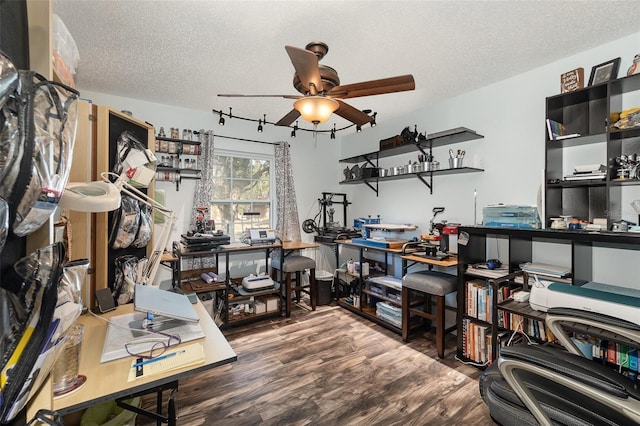 office area with a textured ceiling, wood finished floors, and a ceiling fan