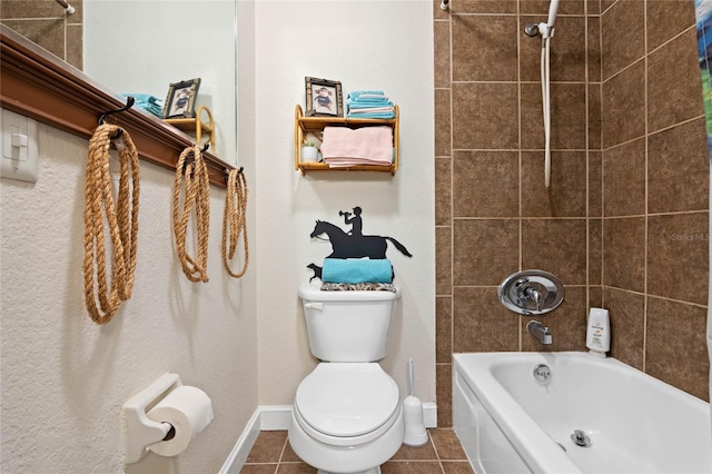 full bath with toilet, baseboards, tub / shower combination, and tile patterned floors