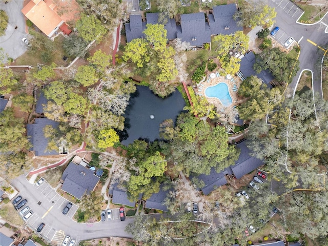 birds eye view of property with a water view and a residential view