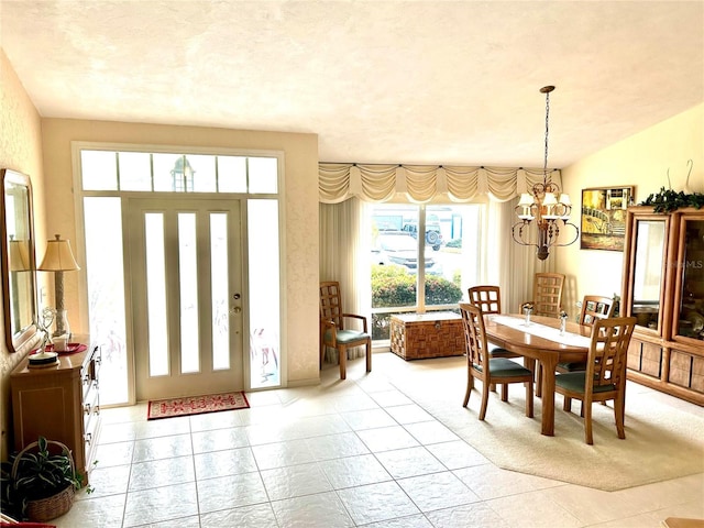 dining room featuring a chandelier and light tile patterned floors