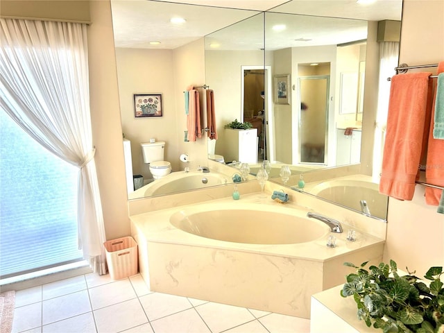 full bathroom with toilet, a stall shower, a garden tub, and tile patterned floors