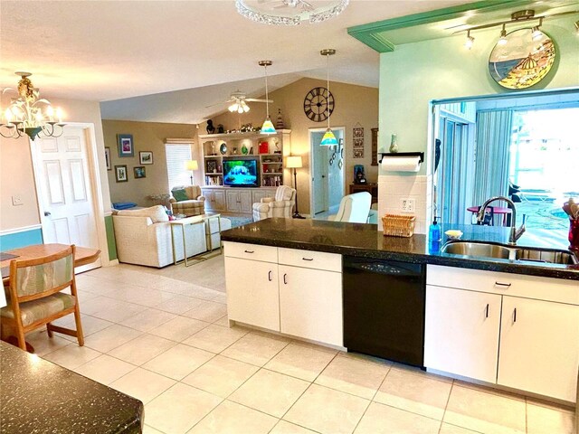 kitchen featuring dishwasher, a sink, hanging light fixtures, white cabinetry, and vaulted ceiling
