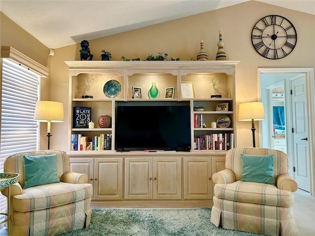 living area featuring lofted ceiling
