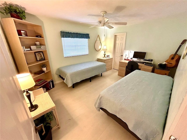 bedroom featuring light carpet and a ceiling fan