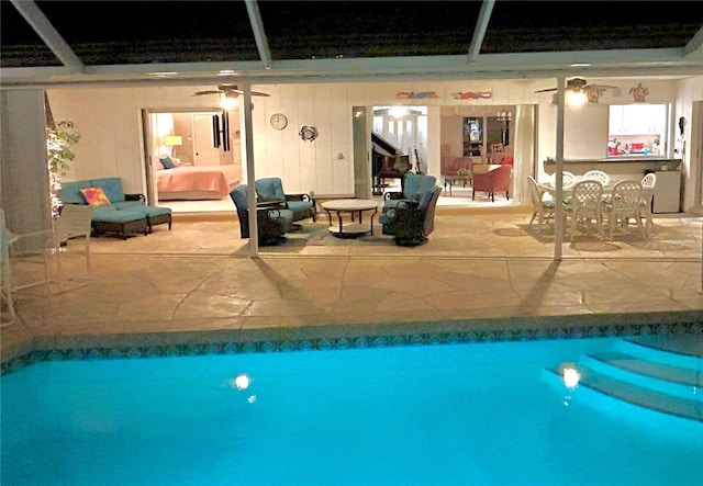 pool at twilight with ceiling fan