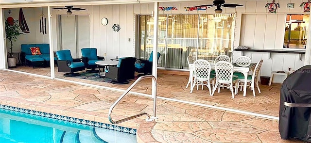 view of patio with a ceiling fan and outdoor dining space