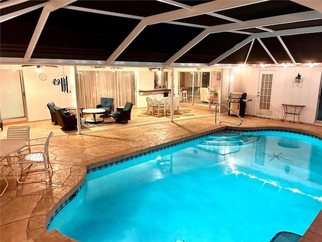 swimming pool with a ceiling fan, a patio, outdoor dining area, and a grill