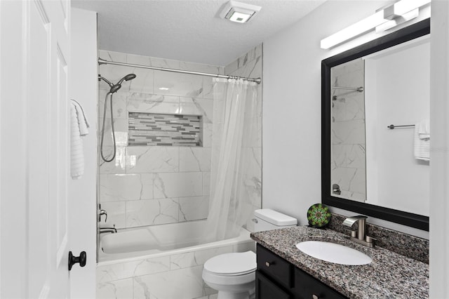 bathroom with vanity, a textured ceiling, tiled shower / bath combo, toilet, and marble finish floor