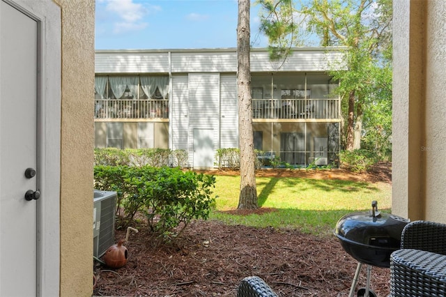 exterior space featuring central AC unit and a sunroom