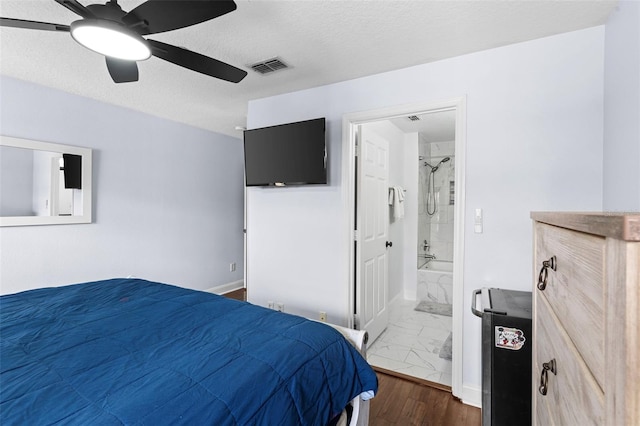 bedroom with baseboards, visible vents, ensuite bathroom, a textured ceiling, and marble finish floor