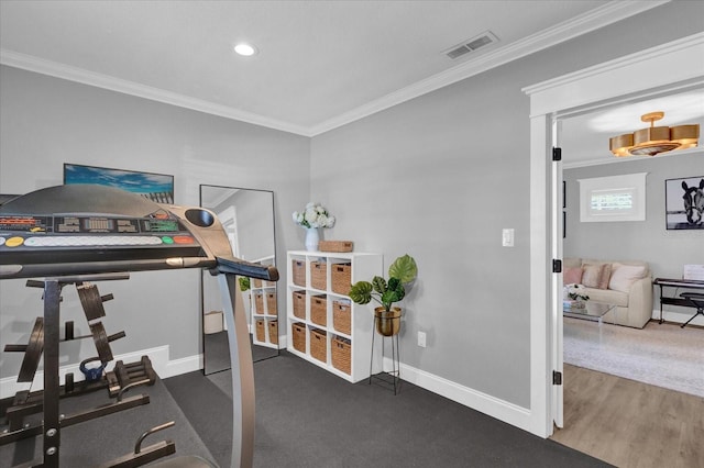 workout room with visible vents, wood finished floors, recessed lighting, crown molding, and baseboards