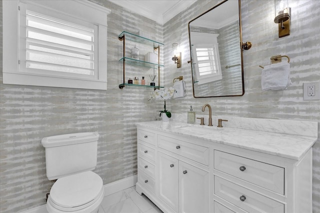 bathroom with vanity, toilet, marble finish floor, and crown molding