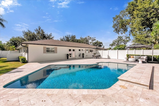 view of pool featuring a fenced backyard, an outdoor hangout area, and a patio