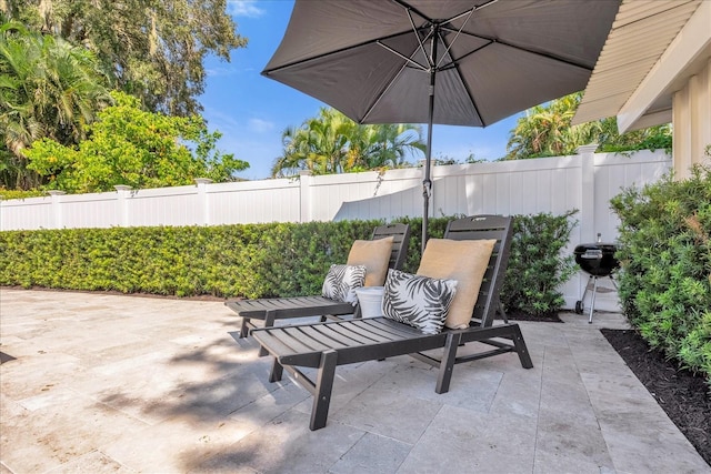 view of patio / terrace with a grill and a fenced backyard