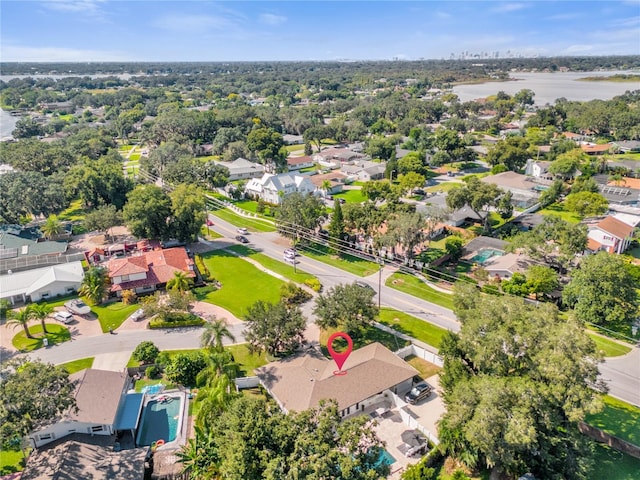 birds eye view of property featuring a residential view and a water view