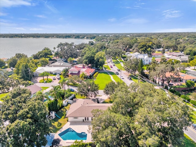 drone / aerial view featuring a residential view and a water view