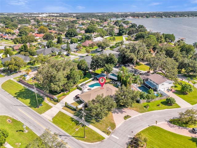 birds eye view of property with a residential view and a water view