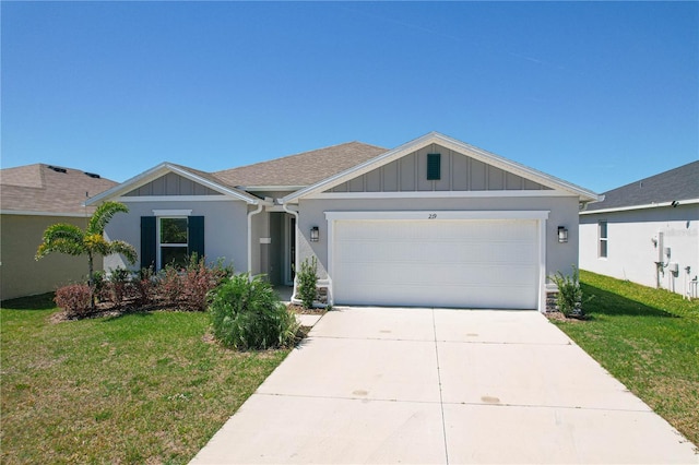 ranch-style house featuring a front yard, driveway, roof with shingles, a garage, and board and batten siding