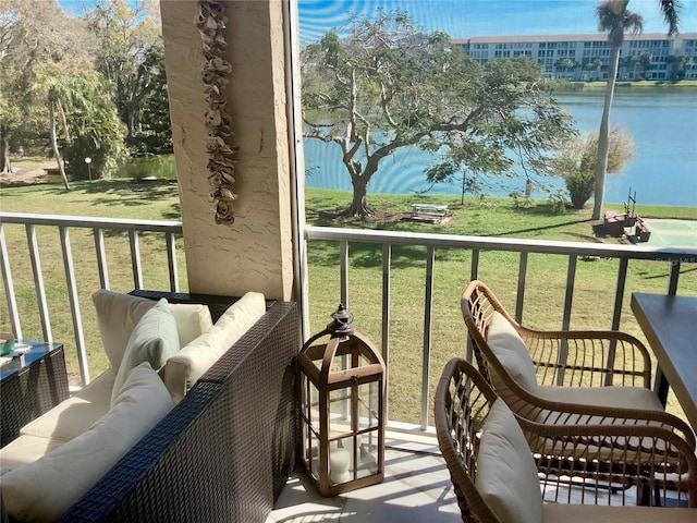 3672 Lake Bayshore Dr Unit K327, Bradenton, FL 34205 - balcony with outdoor lounge area and a water view