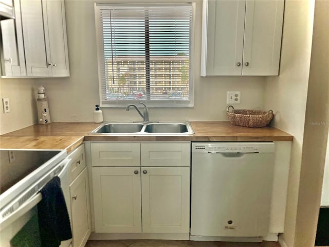 3672 Lake Bayshore Dr Unit K327, Bradenton, FL 34205 - kitchen with light countertops, white appliances, a sink, and white cabinetry