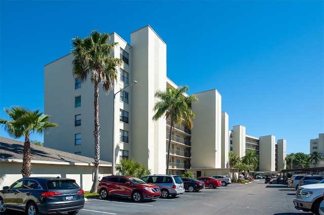 view of property featuring uncovered parking