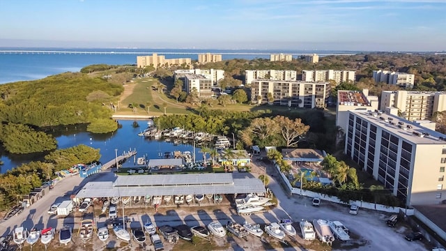 birds eye view of property featuring a water view and a view of city