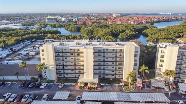 drone / aerial view featuring a view of city and a water view